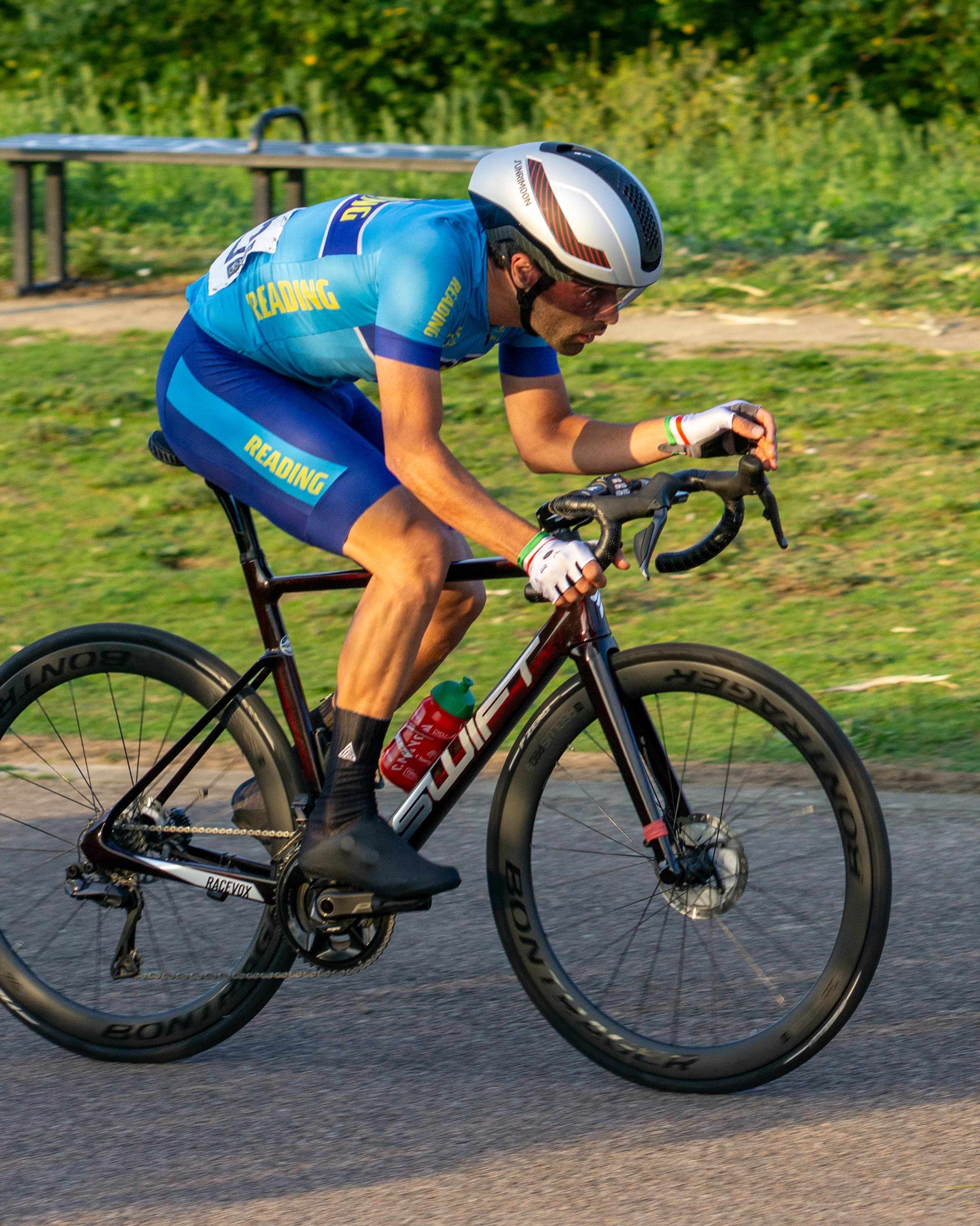 Mohammad in aerodynamic time trial position representing Reading cycling team