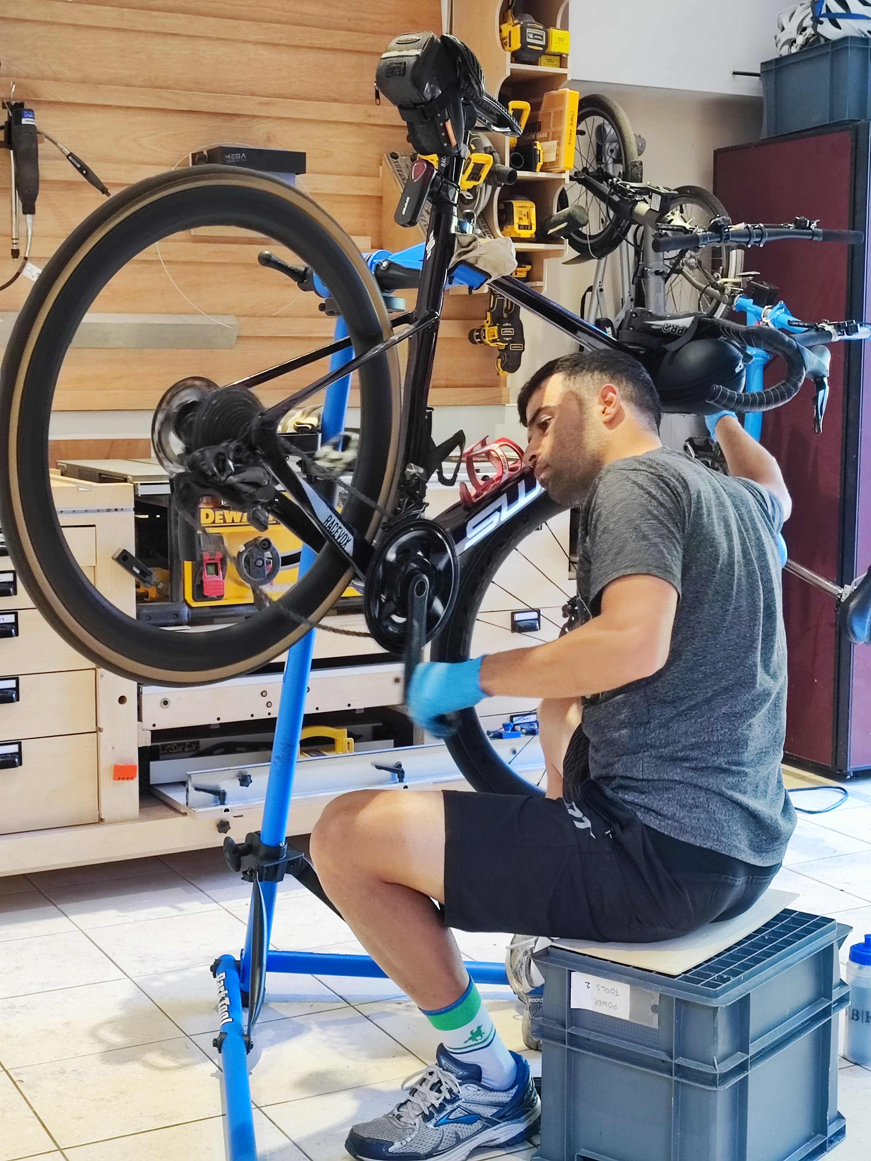 Mohammad performing detailed bike maintenance and repairs